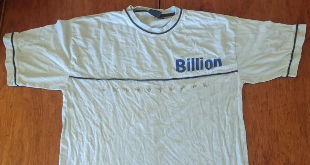 A pale old T-shirt with the word Billion printed on the front
